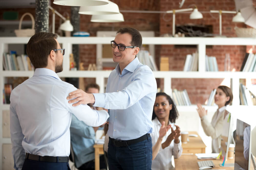 Male boss leading employees