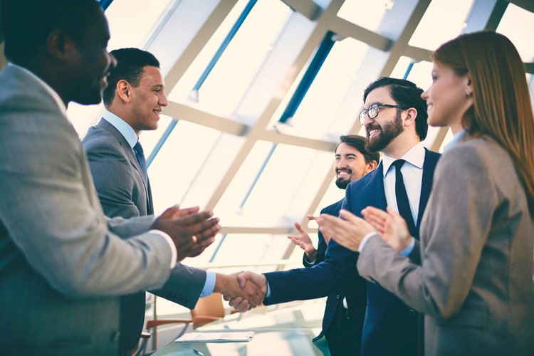 Business people closing deal.