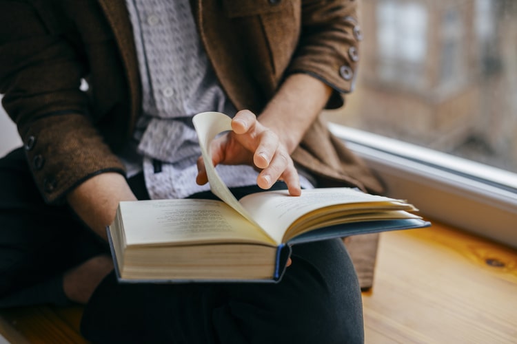 Man reading book successful habit.