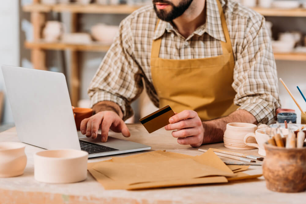 Small business owner using a credit card 